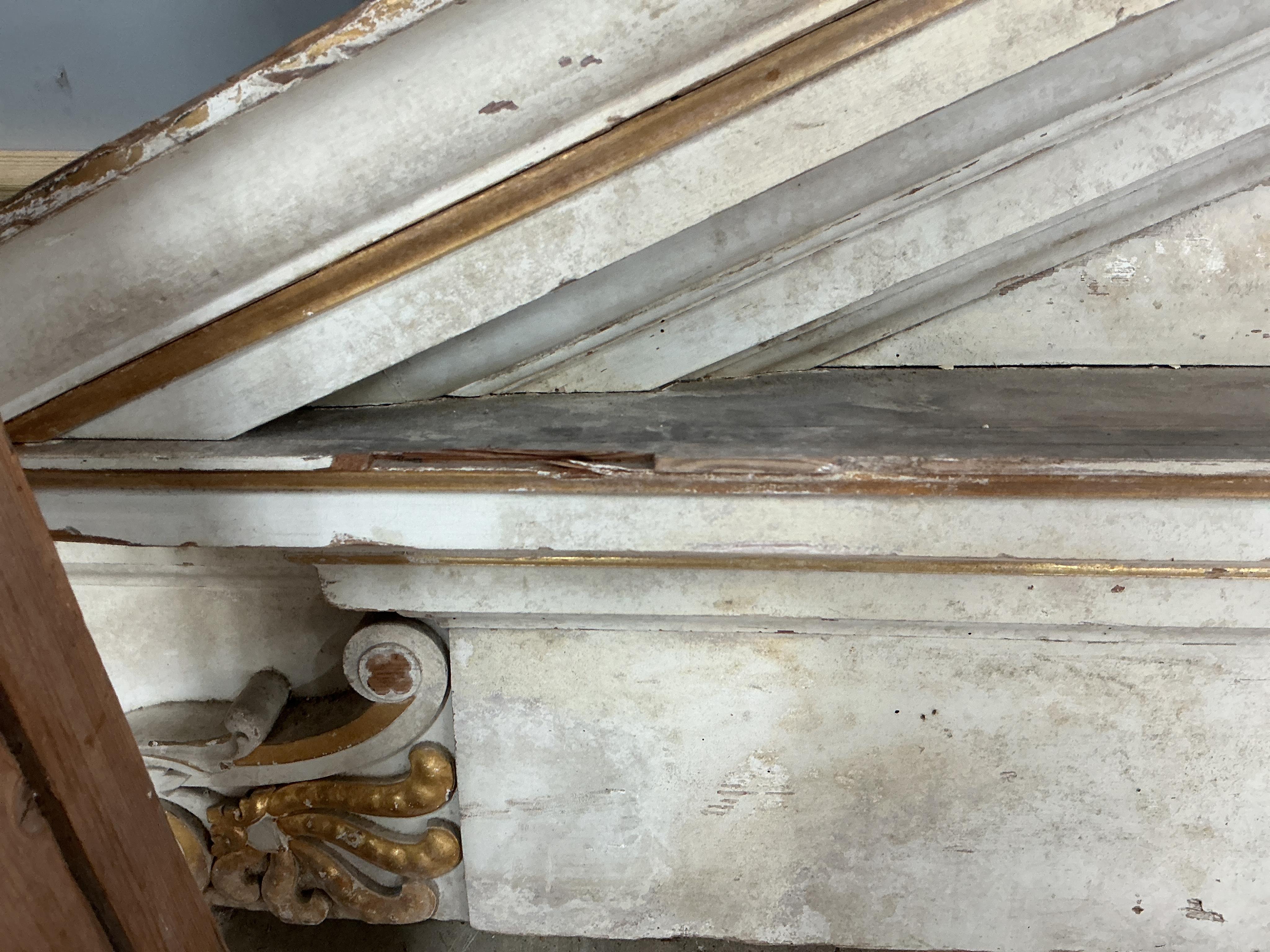 A large late 18th century painted parcel gilt pine door surround, width 154cm, height approximately 266cm
